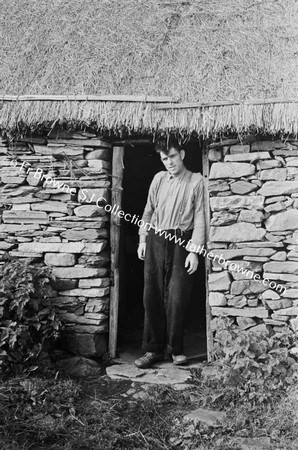 GLENCOLUMBKILLE MAN IN COTTAGE DOORWAY